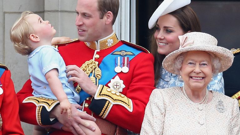 Prince George of Cambridge is held by Prince William, Duke of Cambridge and Catherine, Duchess of Cambridge, Prince Charles, Prince of Wales and Queen Elizabeth II look out on the balcony of uckingham Palace during the Trooping the Colour on June 13, 2015 in London, England