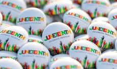 A pile of Juneteenth printed buttons that also say "celebrate freedom"