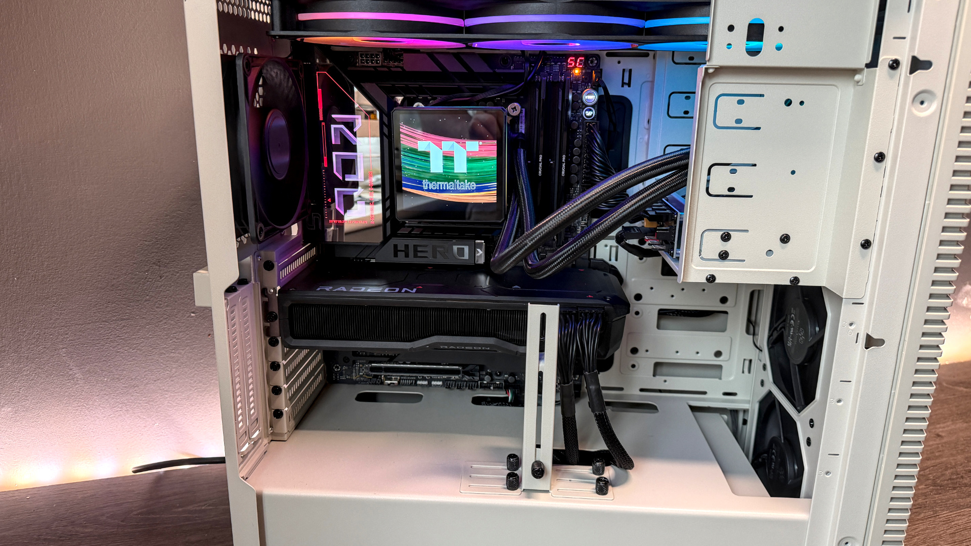 The retro-styled Silverstone FLP02 PC case as a PC is being built into it on a desk.