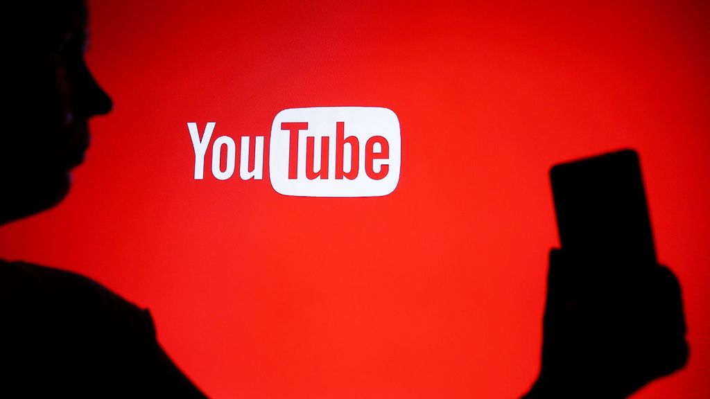 A person holds a phone displaying the YouTube logo in Knurow, Poland, on April 20, 2025.