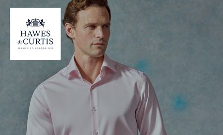 Man wearing Hawes and Curtis's pink button up shirt