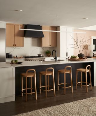 accent colors for a white kitchen, white kitchen with black accents, wooden wall cabinets and bar stools, open plan living