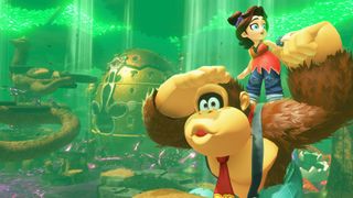 Donkey Kong Bananza screenshot shows DK and Pauline looking around an area shrouded in green light.