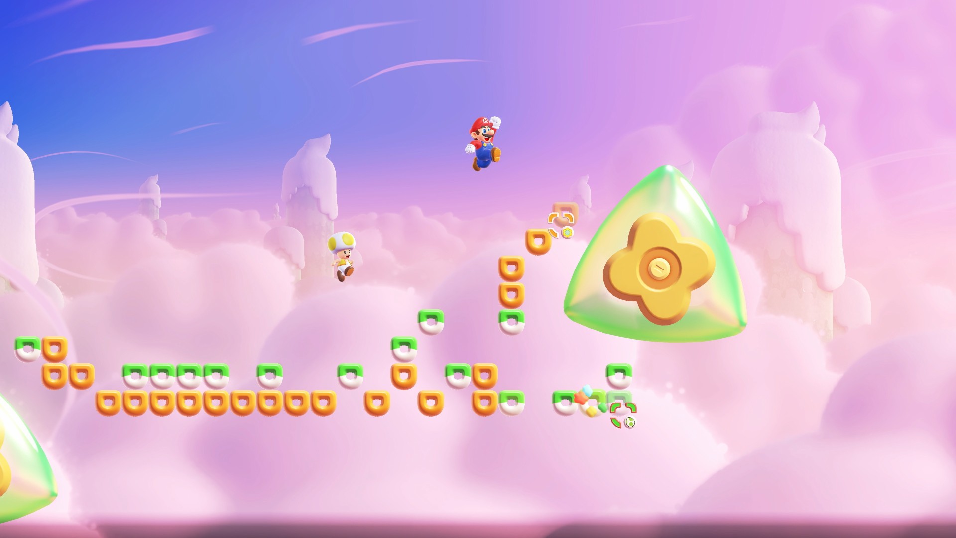 Super Mario Bros Wonder Switch 2 screenshot showing Mario jumping up in the air over small platforms high in the sky towards a flower-shaped block