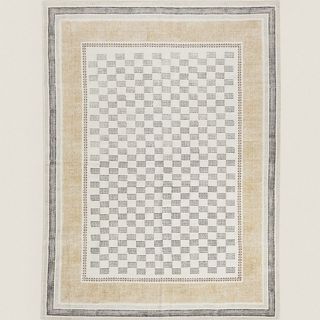 A beige and gray block print rug that's a part of Zara Home's summer sale.