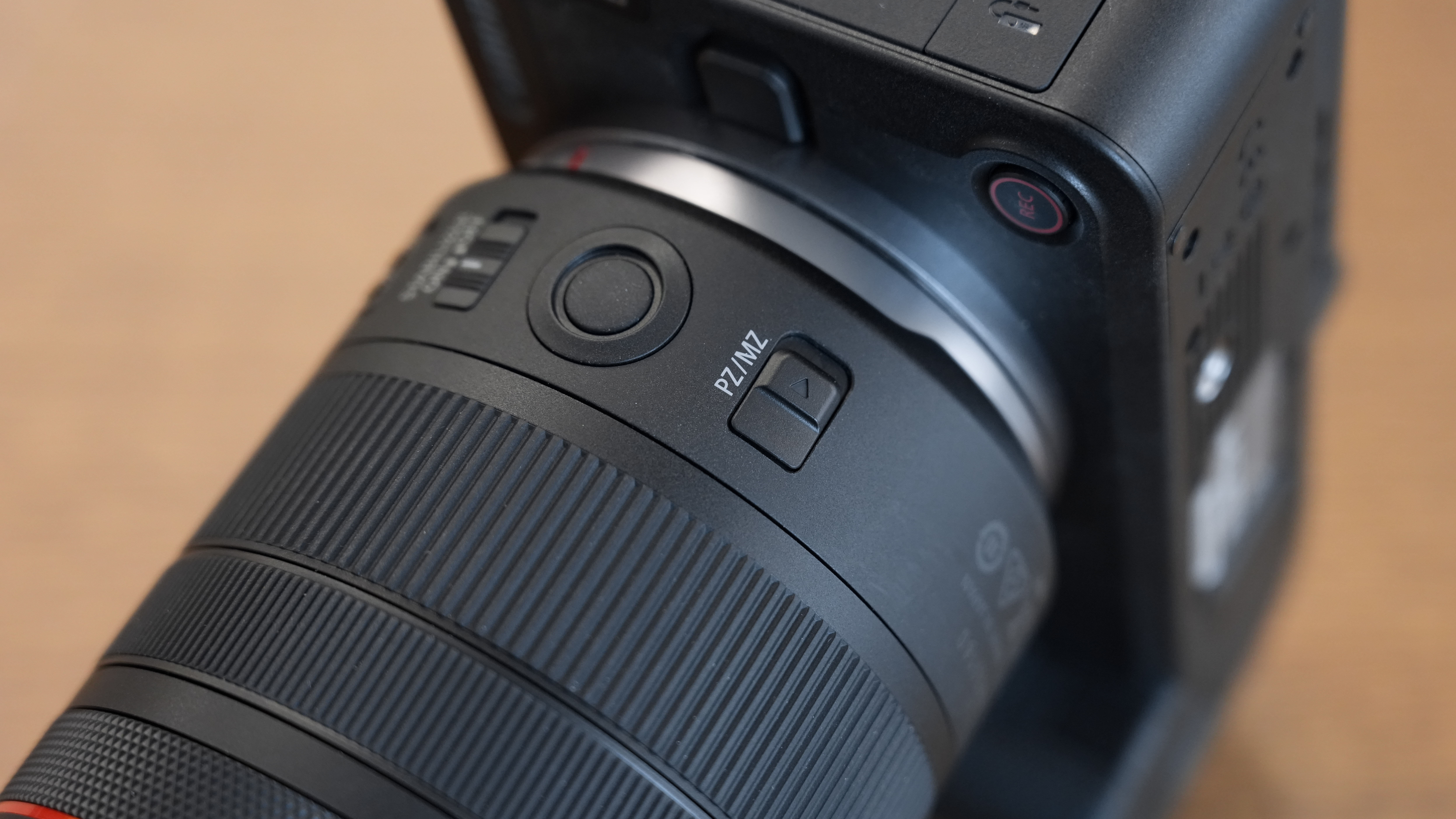 Canon RF 20-50mm f/4L IS USM PZ on a wooden surface