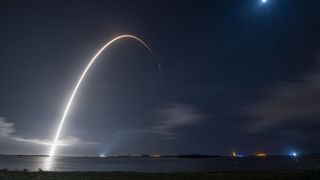 time-lapse image shows arc of rocket into night sky