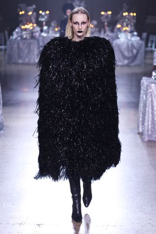 Woman in tinsel dress at Rodarte runway show