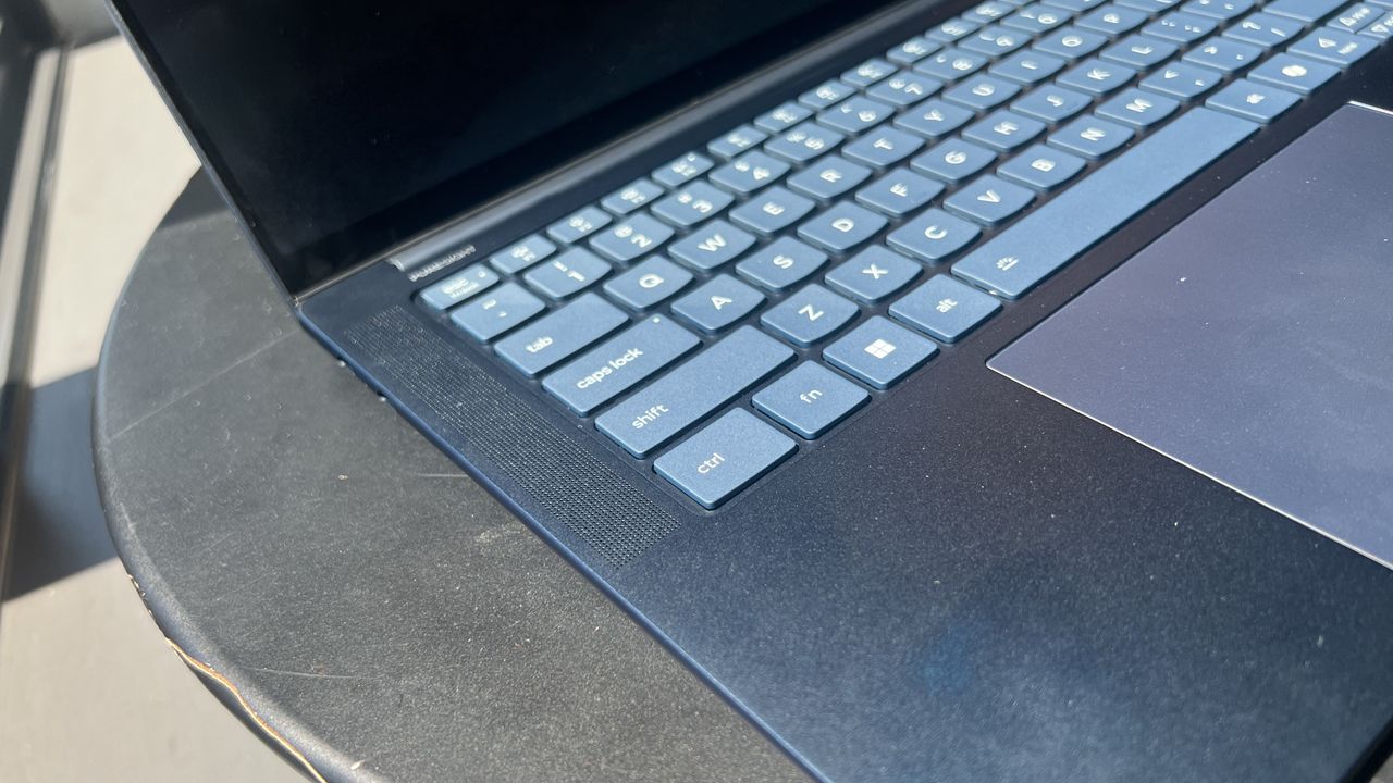 blue laptop on table