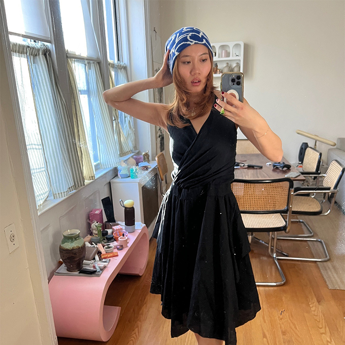 vivian wears fun outfits while taking a mirror selfie in her aesthetic home. 