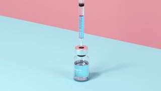 Digital generated image of syringe stuck inside vaccine bottle standing on blue surface against purple wall.