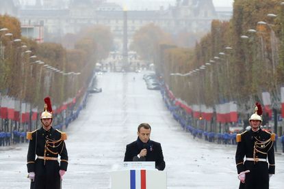 French President Emmanuel Macron delivers a speech during in a ceremony at the Arc de Triomphe in Paris on November 11, 2018 as part of commemorations marking the 100th anniversary of the 11 