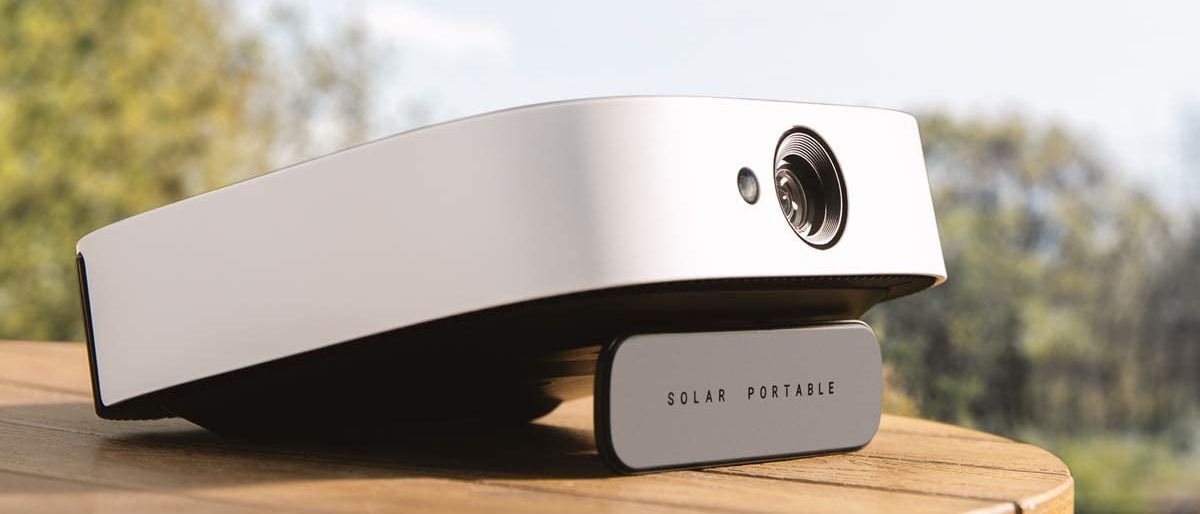 Anker Nebula Solar Portable projector on an outdoors table