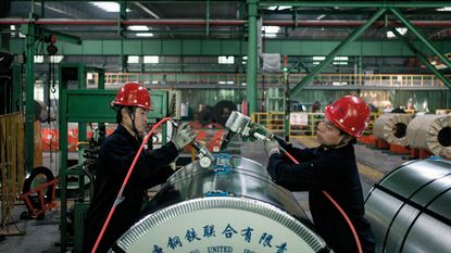 Workers in a Chinese steel factory