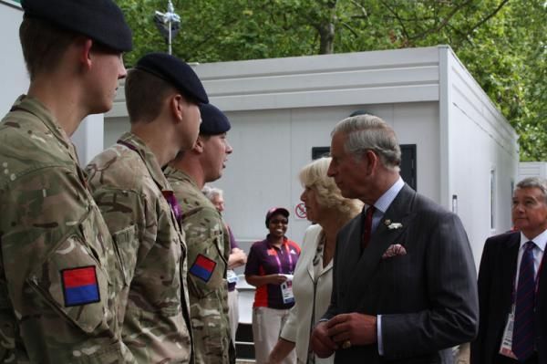 Prince Charles greet British soldiers who have helped the Games with added security
