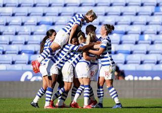 Natasha Dowie is mobbed after scoring