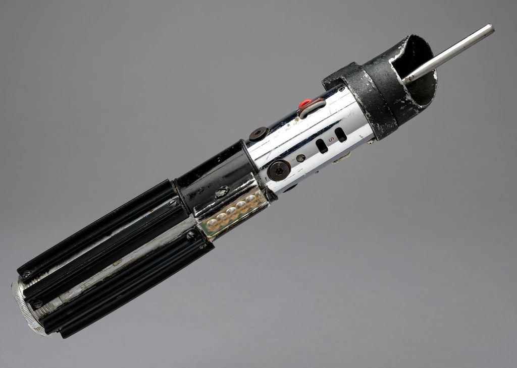 a sci-fi movie prop of a lightsaber hilt