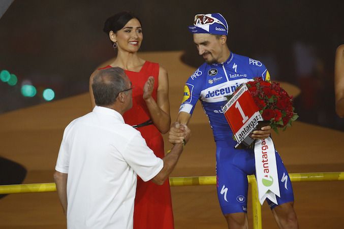 Deceuninck-QuickStep's Julian Alaphilippe is awarded the 2019 Tour de France's 'Super Combatif' prize by 1985 Tour winner Bernard Hinault