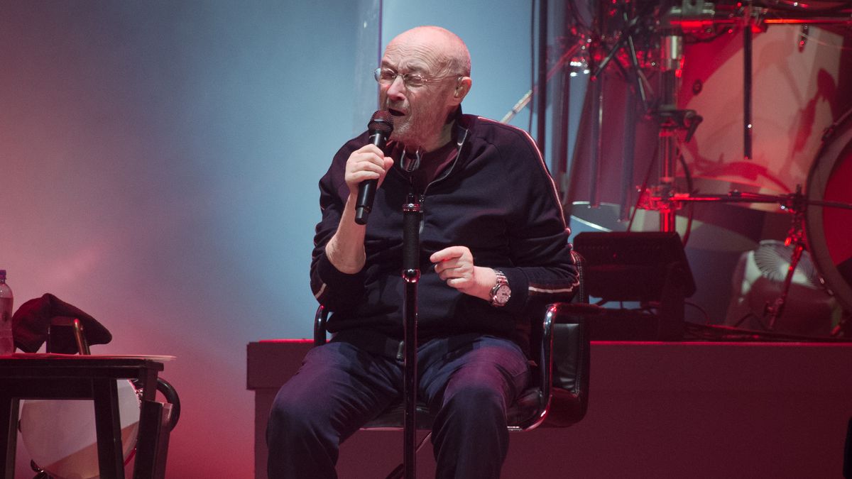 Phil Collins performing with Genesis in 2022