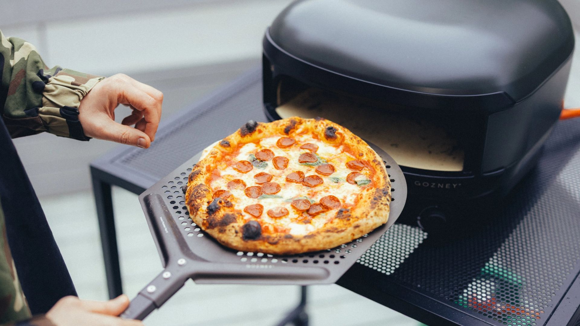 The Gozney Arc Lite Pizza Oven being used to cook pizza