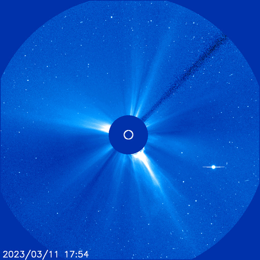 a blue-and-white image of the sun spewing a coronal mass ejection
