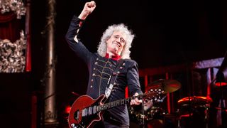 Brian May performs with Queen in 2022