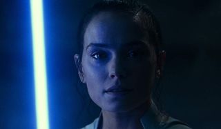 Rey with lightsaber in Star Wars: The Rise of Skywalker