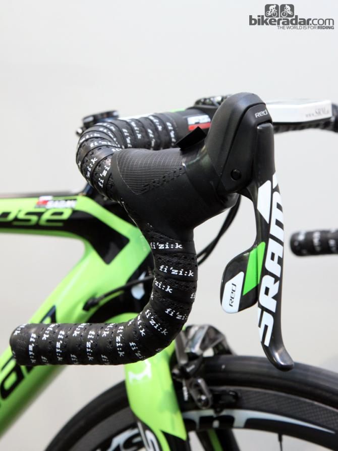 According to Cannondale global road marketing manager Jonathan Geran, the team puts strips of electrical tape around the levers any time the bikes will see time atop the team car so as to keep debris and water out of the shifter internals. The tab up top makes it easy to rip the tape off when necessary