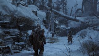 Kratos follows Atreus through a snowy Midgard