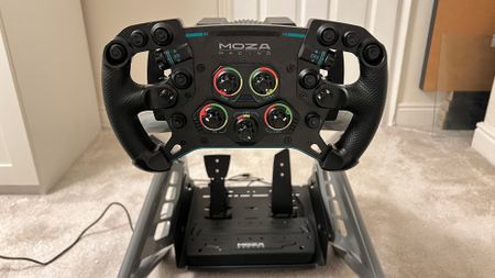 Moza R12 with Moza's F1-style wheel mounted to it