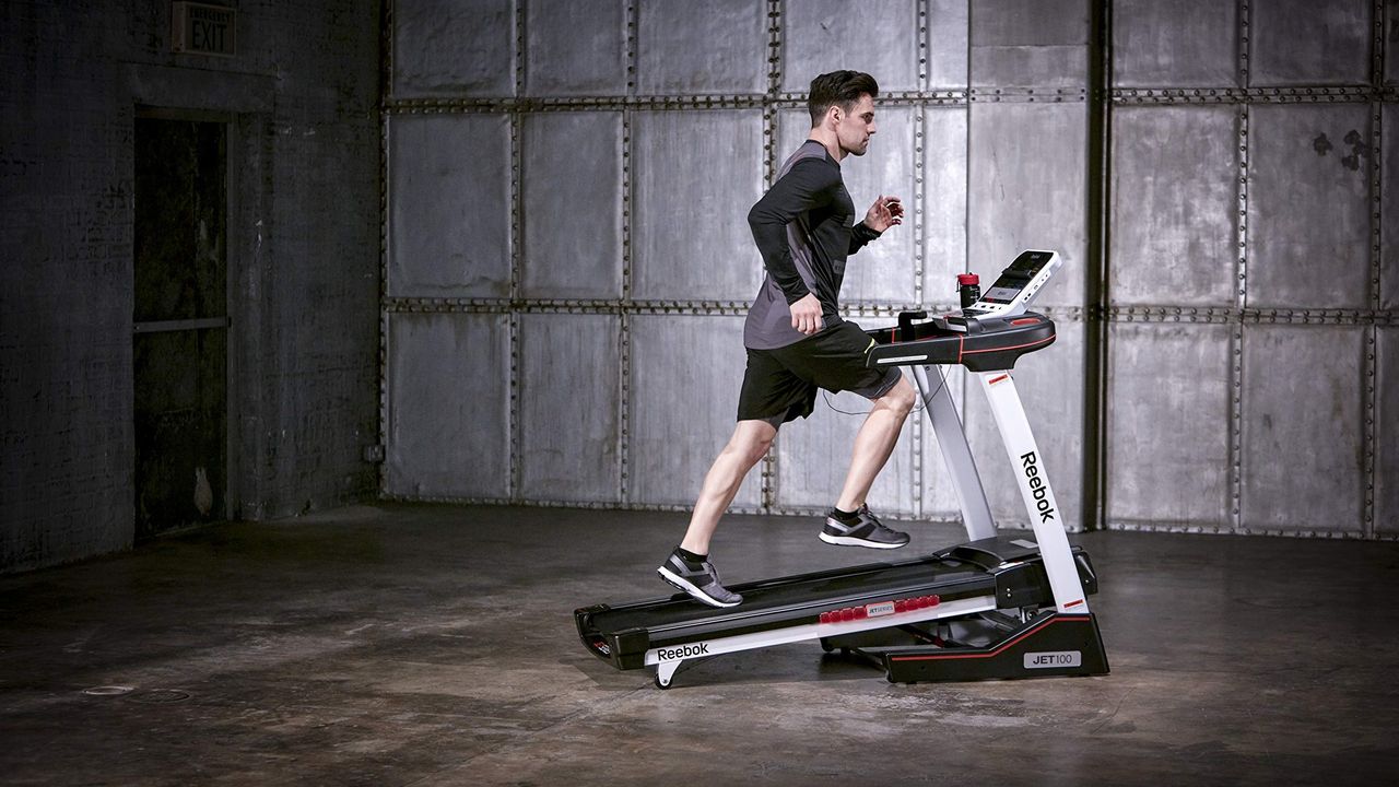 Person running on the Reebok Jet 100 Series Bluetooth Treadmill