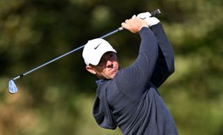 Rory McIlroy plays an iron shot