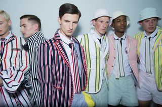 Group of male models wearing striped shorts & striped jackets