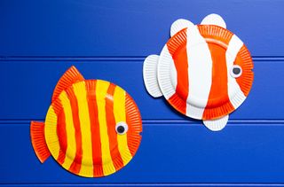 Paint the paper plate fish in stripes
