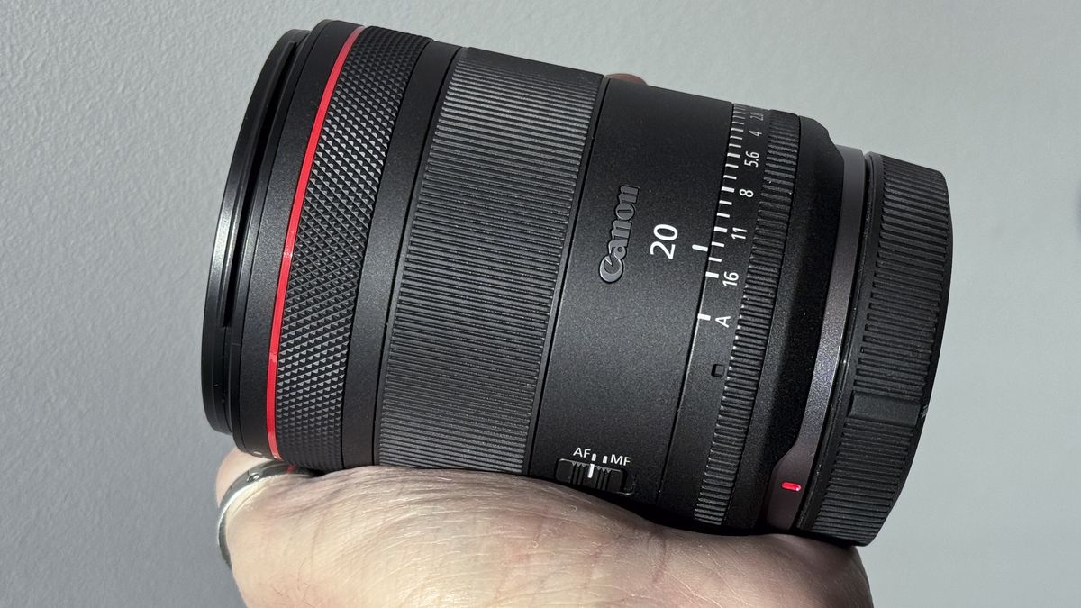Canon RF 20mm f/1.4L VCM lens being held in hand
