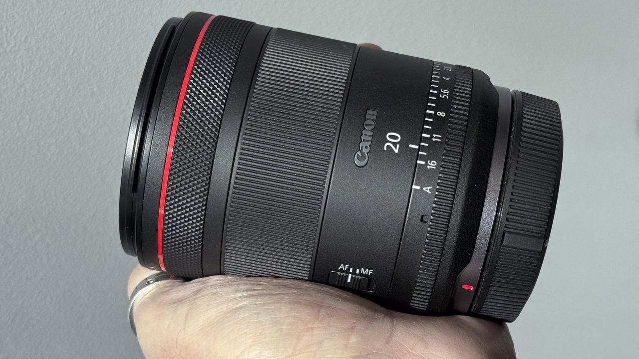 Canon RF 20mm f/1.4L VCM lens being held in hand