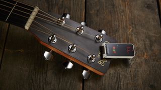 Best clip-on guitar tuners: TC Electronic Polytune Clip attached to a Martin acoustic guitar's headstock