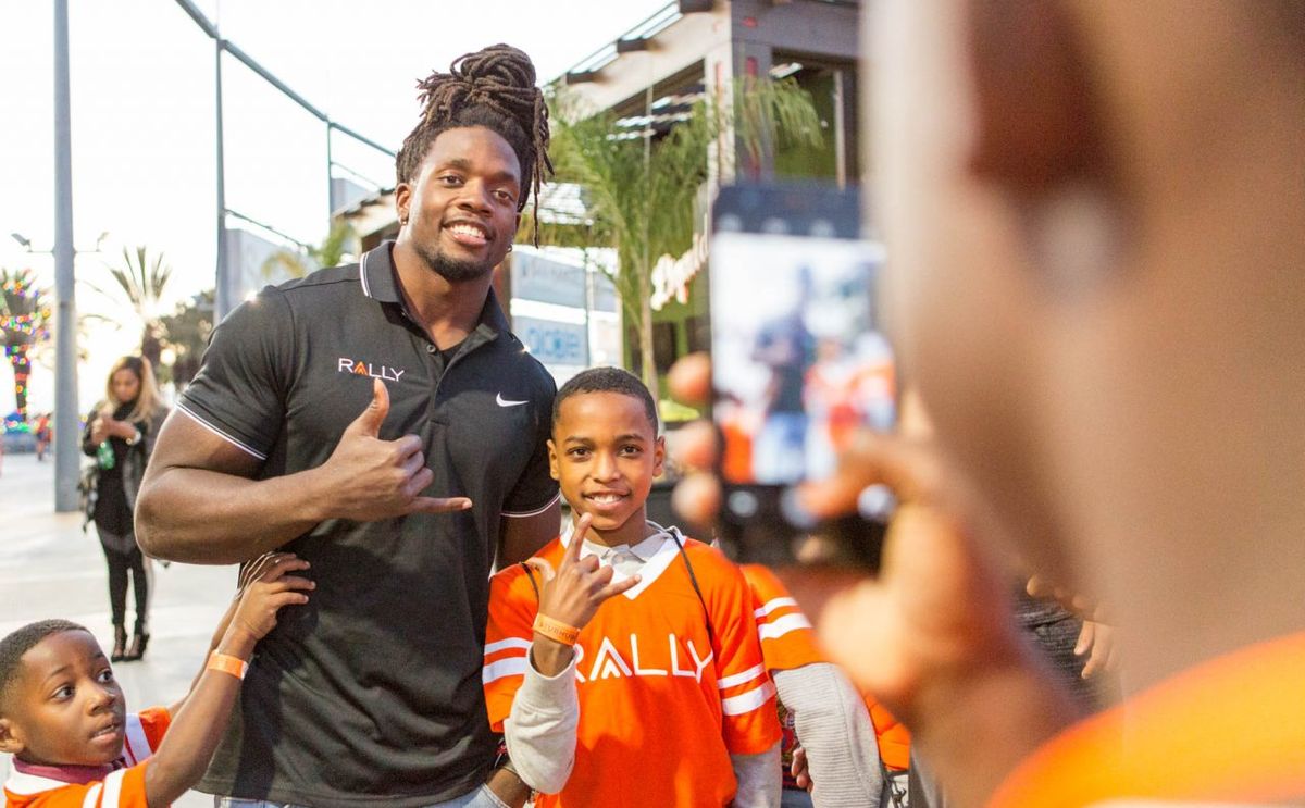 Melvin Gordon poses with one of the recipients at the recent bike build
