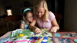 A mother and daughter scapbooking