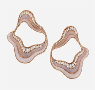 a pair of wavy shaped earrings made with pink opals and diamonds