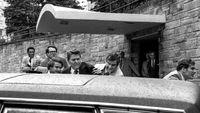 In this March 30, 1981 file photo, U.S. President Ronald Reagan, center, is shown being shoved into the President's limousine by secret service agents after being shot outside a Washington hotel. The man who shot Reagan is scheduled to leave a Washington mental hospital for good on Saturday, Sept. 10, 2016, more than 35 years after the shooting. A federal judge ruled in late July that the 61-year-old John Hinckley Jr. is not a danger to himself or the public and can live full-time at his mother's home in Williamsburg, Virginia. (AP Photo/Ron Edmonds, File)