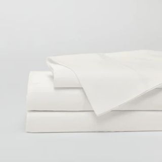 Cozy Earth Creme Sheets against a gray background. 