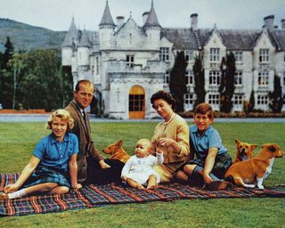 Photograph of Queen Elizabeth II with the Duke of Edinburgh and their children at Balmoral Castle