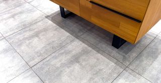 gray tiled floor with wooden cabinet to support how to clean tile floor grout