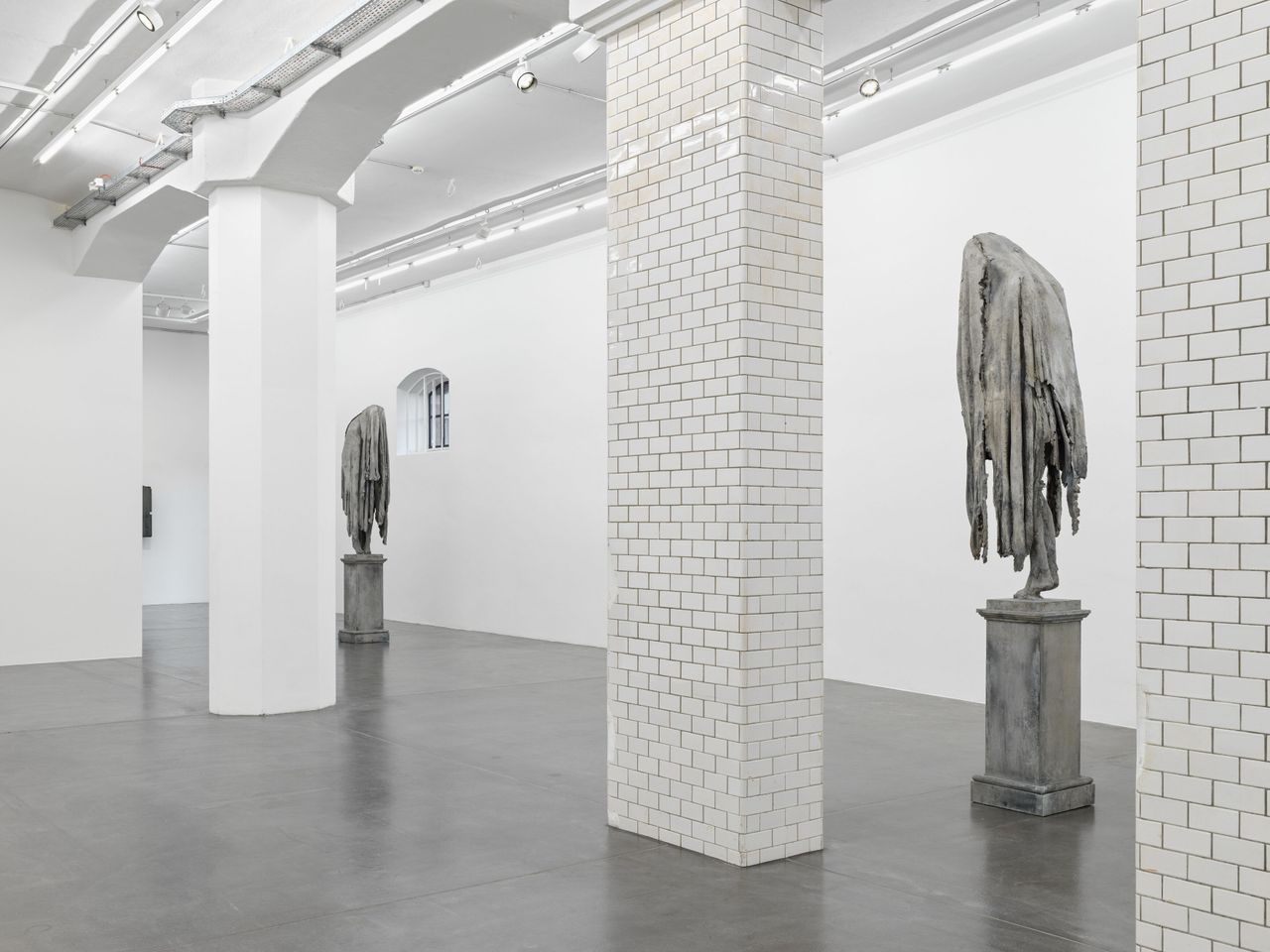 sculptures on show at hauser &amp; wrth zurich, as part of berlinde de bruyckere&#039;s show, two human figure in grey