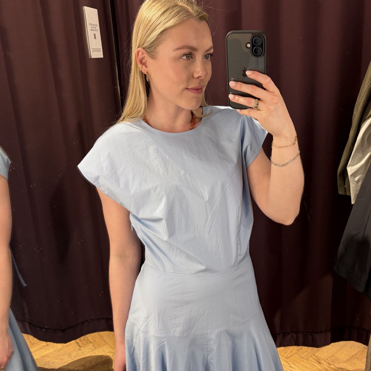 Woman wears blue dress