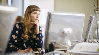 Woman concentrating on computer screen