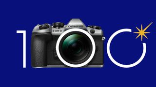 Olympus OM-D E-M1 Mark II Silver camera, against a blue background, with the Olympus 100 year anniversary logo