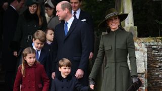 The Cambridge family walking out of the Christmas Day service