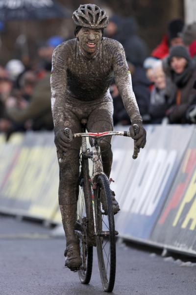 Zdenek Stybar's rainbow jersey was pretty much invisible under all that mud